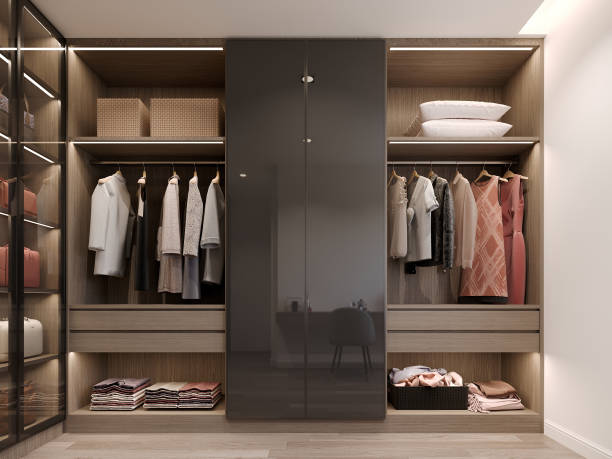 istock modern walk in closet wardrobe with clothes hanging interior design, 3d rendering 1494598024