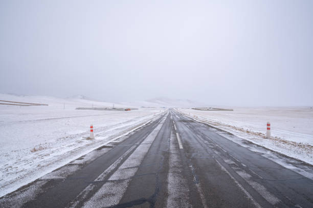 istock Snow covered the highway road in winter, Mongolia 1494600561