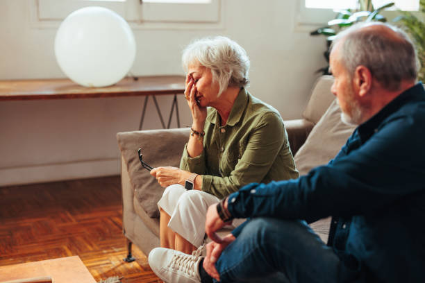 istock Senior woman looking devastated while sitting in therapy with husband. 1494603120