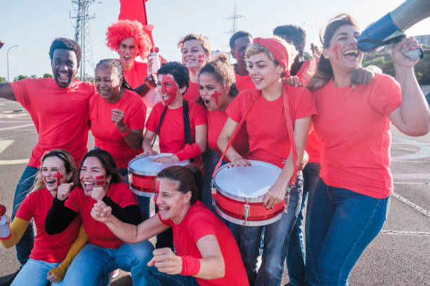 istock Group of fans from different places gathered supporting a team and its colors 1494603521