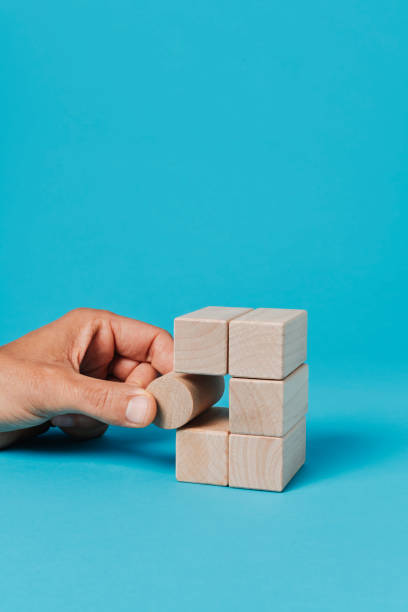 istock man plays with toy blocks 1494606383