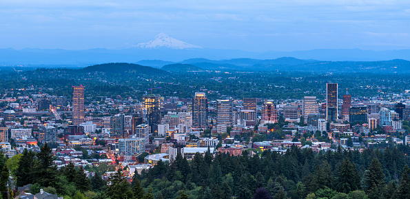 A panoramic overview of downtown Portland, as seen from Pittock Mansion, on a stormy Spring evening. Oregon, USA.