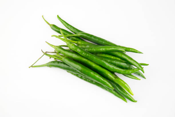 Green chillies isolated against white background Green chillies isolated against white background healthy eating red above studio shot stock pictures, royalty-free photos & images