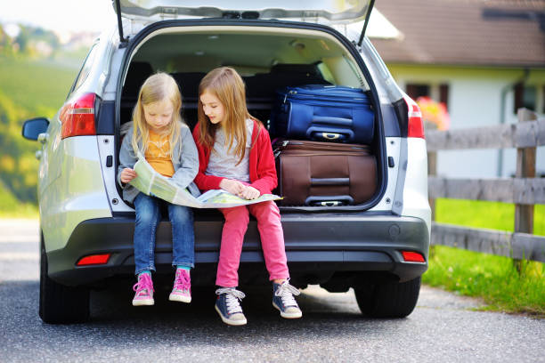 istock Two adorable little sisters exploring a map before going on vacations with their parents 1494610743