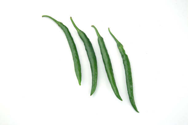 istock Green chillies isolated against white background 1494610935