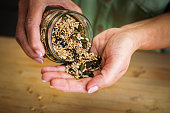 Healthy seeds and nuts on the palm of hand