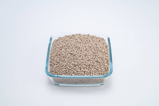 istock Close-up of brown plastic polymers in a square transparent bowl 1494617608