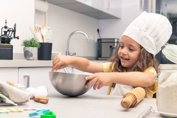 Kitchen Confections: Girl Experimenting with Flavors and Textures in Pastry Making