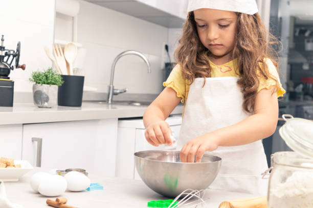 istock Flour Power: Girl Harnessing the Magic of Baking in the Kitchen 1494617937