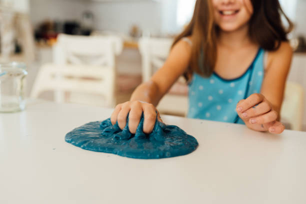 istock Girl playing with sticky slime 1494618080