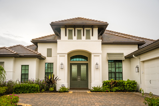 Sarasota, FL, US-September 26, 2022: Exterior of newly built modern luxury house in suburban neighborhood.