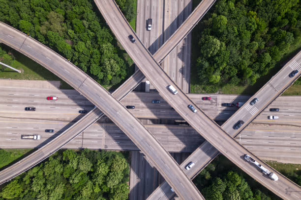 istock An aerial view of a highway intersection with a traffic intersection. 1494619821