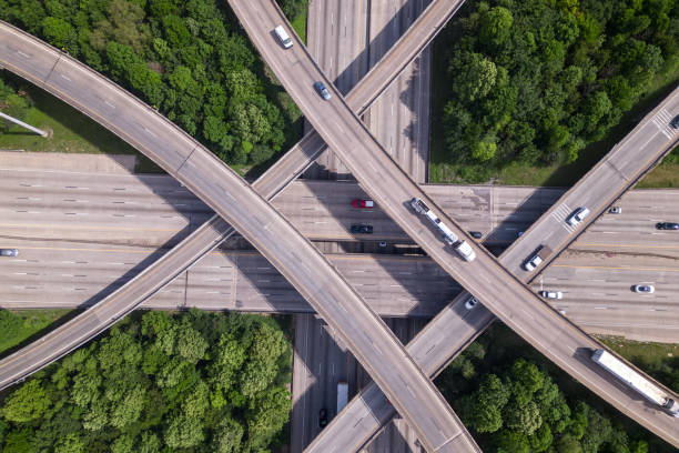 istock An aerial view of a highway intersection with a traffic intersection. 1494619831