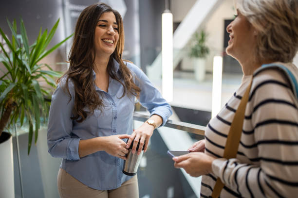 istock Women talking in building hallway 1494621536