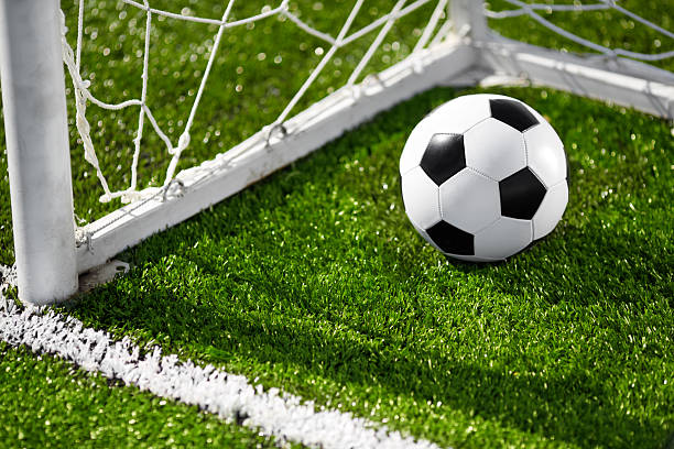istock Soccer ball and goal net 149462223