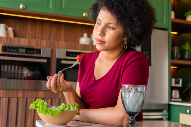 istock woman eating salad 1494622937