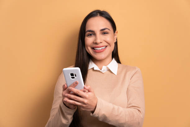 istock woman watching video and photos on mobile 1494623004