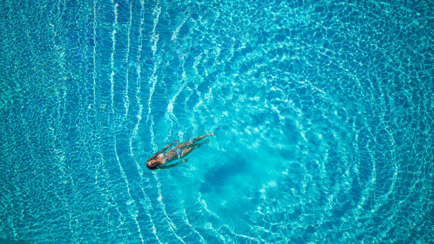 istock Woman Swimming In The Pool 1494623374