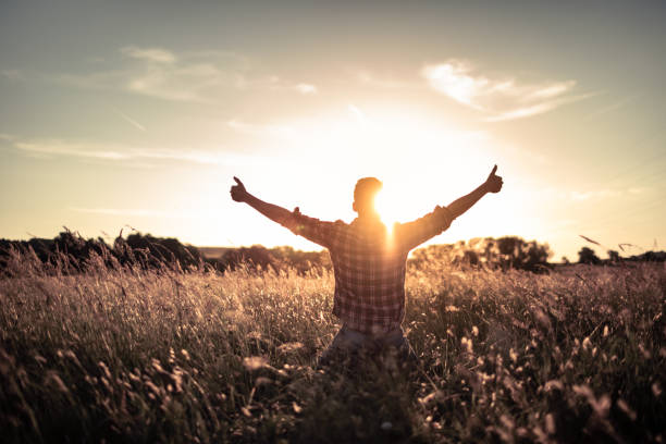 istock Happy person young man with arms outstretched having a positive mindset 1494624879