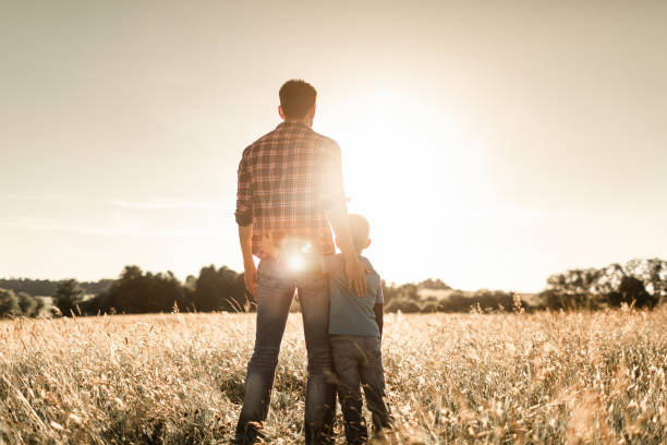 istock Young father and son spending time together bonding in nature. 1494624976