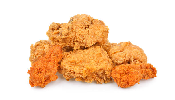 istock Heap of fried chicken isolated on white 1494625062