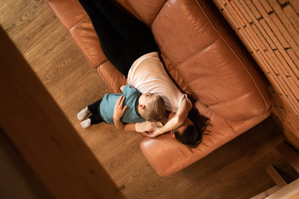 istock Sad mother and child at home. top view 1494625099