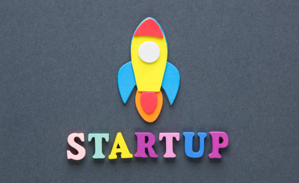 istock Space rocket and word startup on a gray background. Business concept 1494625221