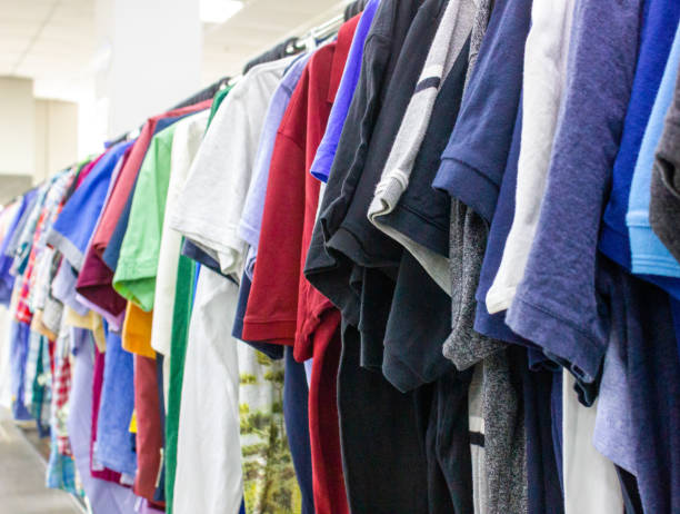 istock Clothing store background.Clothes on hangers background. Multi-colored textiles, fabric, clothes, t-shirts, shirts, dresses. 1494625418