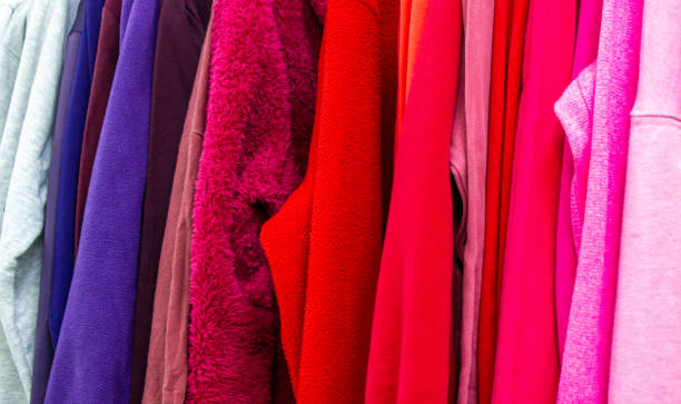 istock Clothing store background.Clothes on hangers background. Multi-colored textiles, fabric, clothes, t-shirts, shirts, dresses. 1494625976