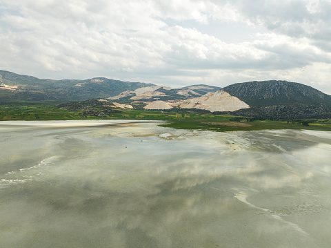 Aerial view of marble quarry by the lake. Burdur, Turkey. Taken via drone.