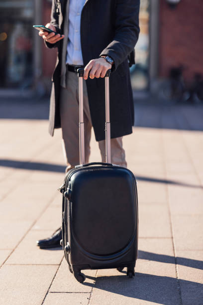 istock Unrecognizable Business Man Using A Mobile Phone At Train Station 1494628478