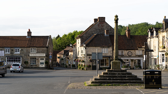 Helmsley, North Yorkshire, UK - May 29, 2023.  Landscape panorama of the market square and memorial in the popular Yorkshire tourist destination of Helmsley