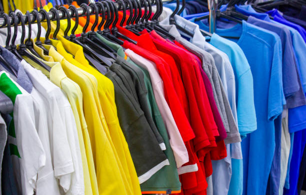 istock Clothing store background.Clothes on hangers background. Multi-colored textiles, fabric, clothes, t-shirts, shirts, dresses. 1494630113