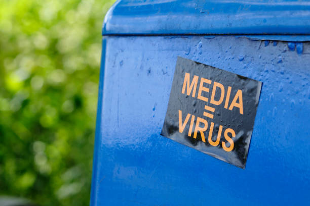 Sticker on a public trash can with text media = virus