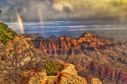 A rainbow appears  over the Grand Canyons North rim