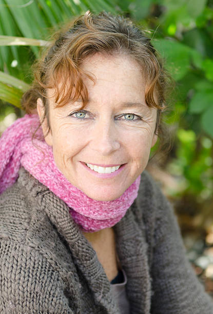 Close up portrait of smiling mature woman stock photo