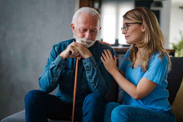 istock Young nurse spend time with old man, shares his pain, express empathy 1494635241