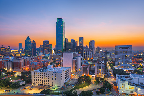 Dallas, Texas, USA downtown city skyline at dawn.