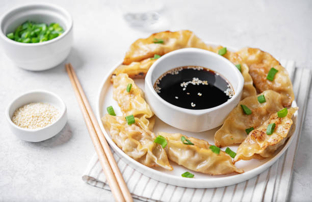 istock Dumplings with soy sauce in a plate 1494638429