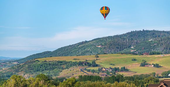 Morning arrives with the view of Steamboat Springs for Travelers and Tourists on a Hot Air Balloon