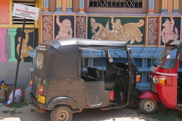 Auto rickshaw parked outside a No Parking sign Trincomalee, Sri Lanka – 04.17.2022: Auto rickshaw parked outside a no parking sign during Sri Lanka’s economic crisis no rickshaws sign stock pictures, royalty-free photos & images