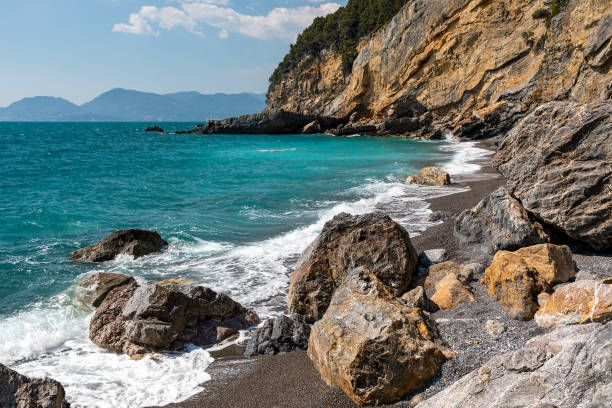 Summer view of natural beach near Tellaro, Lerici, Liguria, Italy Summer view of natural beach near Tellaro, Lerici, Liguria, Italy rocky coastline stock pictures, royalty-free photos & images