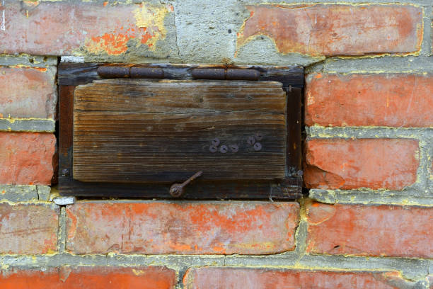 istock Old wooden box in a brick wall 1494644795