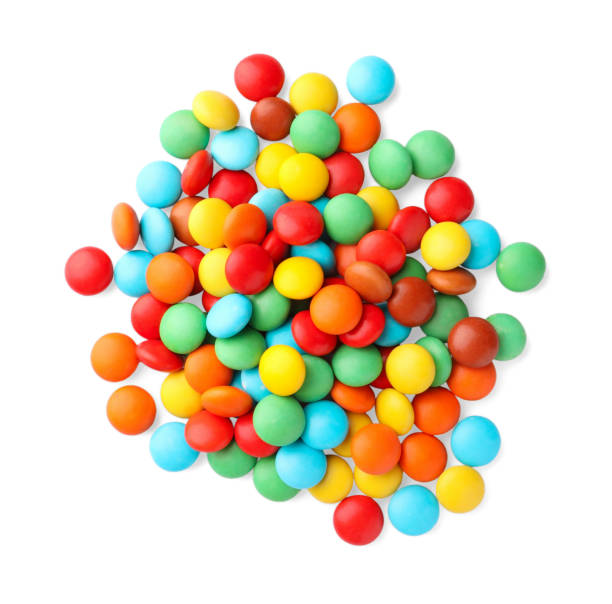istock Many small colorful candies on white background, top view 1494646071