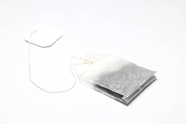 istock dry tea bag on a white background. One rectangular tea bag closeup. Herbal and black tea bags. 1494646246