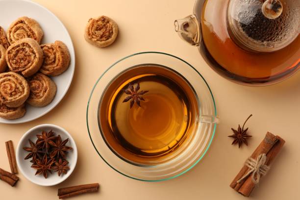 istock Flat lay composition with aromatic tea, cookies and anise stars on beige table 1494646428