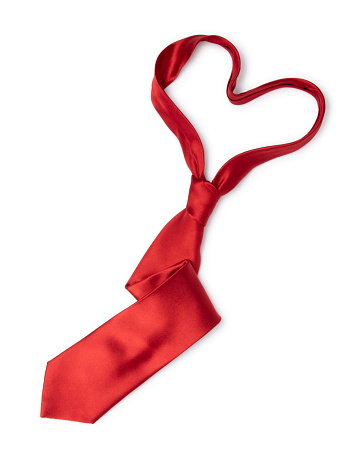 This is a conceptual symbol for Father's day with a red tie in the shape of a heart isolated on a white background