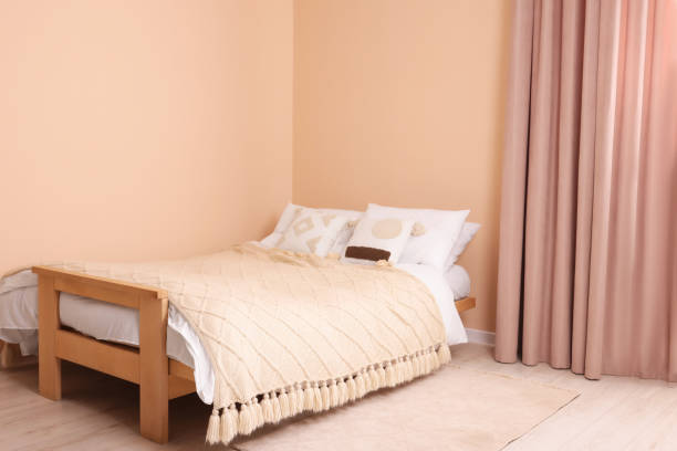 istock Stylish bed with pillows in room. Interior design 1494649050