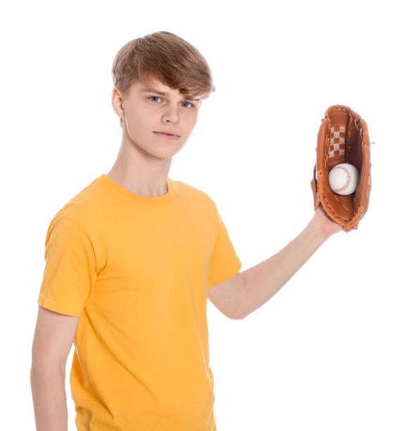 istock Teenage boy with baseball ball on white background 1494650041