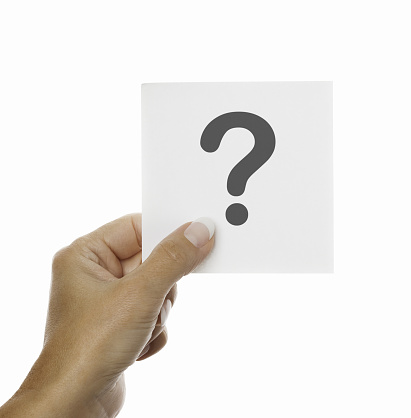 Women hand holding sticky note with question mark on white background